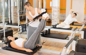 people exercising reformer pilates